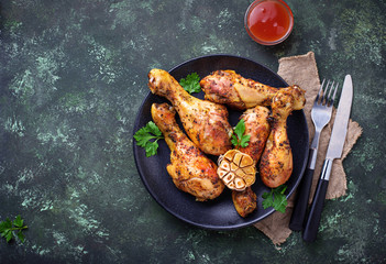 Grilled chicken legs with spices and garlic.