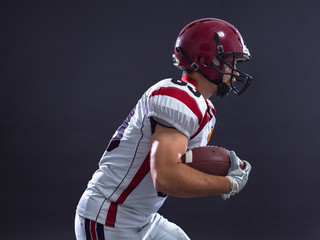 Wall Mural - American football Player running with the ball