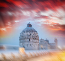 Poster - Baptistery of Pisa after a winter snowfall at sunset. Square of Miracles at dawn