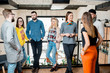 © rh2010 - Group of friends dressed casually talking together during the coffee break standing in the white conference hall