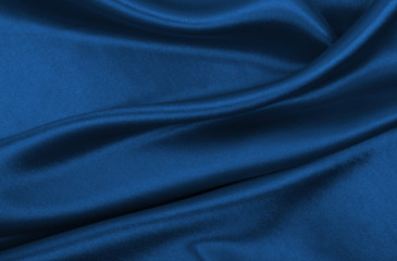 smooth elegant blue silk or satin luxury cloth texture as abstract background. luxurious background 