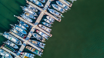 Wall Mural - Aerial view Yacht parking, A marina lot, Yacht and sailboat is moored at the quay, Aerial view by drone.
