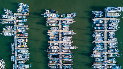 Canvas Print - Aerial view Yacht parking, A marina lot, Yacht and sailboat is moored at the quay, Aerial view by drone.