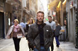 © Khorzhevska - Handsome middle-aged man walking autumn street. Urban male portrait, image toned and noise added.