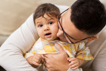 happy father with little baby daughter at home