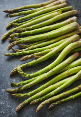 Poster - Fresh  raw asparagus on stone background