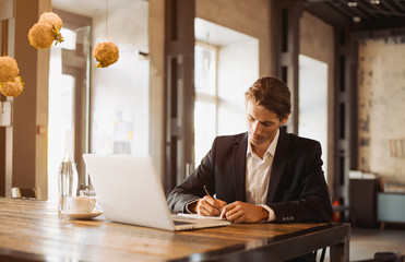 Adult serious man has business conversations using on-line mobile application. Developer innovational business web applications in the internet. Stylish guy. Business portrait. Cloud technologies.