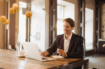 adult serious man has business conversations using on-line mobile application. developer innovationa