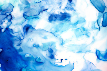 Abstract watercolour background, blue shades on white backdrop. Hand drawn paiting, play of colors. Water drawing, symbol of emotions, beginnings, intuition, creativity, dreams and creation.