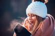 © leszekglasner - Woman breathing on her hands to keep them warm at cold winter