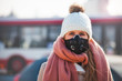© leszekglasner - Young woman wearing protective mask in the city street, smog and air pollution