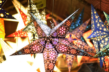 Christmas stars hanging on a stall