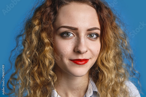 Close Up Portrait Of Happy Friendly Looking Young Lady With