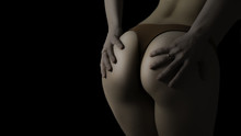 Butt Of Sexy Woman's Hips On Black Background