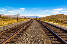 Railroad Tracks Going Through Mojave Desert In California