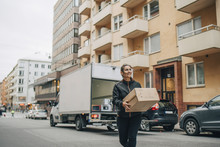 Delivery Woman Carrying Box