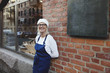 © Maskot - Portrait of mature woman wearing apron
