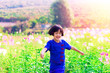 Asian small girl playing farm flower in sunny day happy and enjoyed beautiful weather