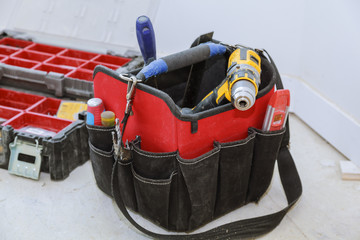 set of tools in a bag on wooden background