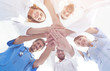 © ASDF - bottom view.a team of doctors at the medical center clasped thei