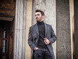 © starsstudio - Handsome bearded young man outdoor in winter fashion, wearing black turtleneck sweater and woolen blazer jacket in city setting