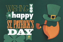 Close Up View Of Paper Made Green Hat And Beard With Wishing You A Happy St Patricks Day Lettering On Green Background