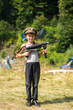 © Niko_Dali - A little boy in his cap holds a trophy weapon MP-40 from the Second World War