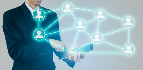 business network concept,man pointing or touching the social media symbol on internet network concep