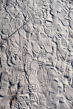 Various Of Footprints On Dry Sand Floor Background