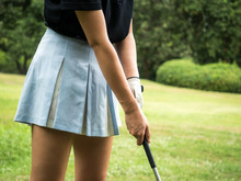 Golfer Woman Tee Off Golf Ball Before Swing.