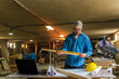 © cherryandbees - Taking measures. middle aged wood engineer working in his workshop