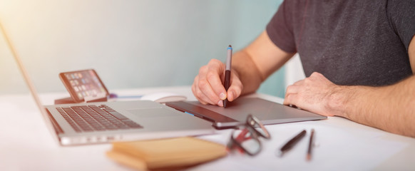 Graphic designer working using laptop