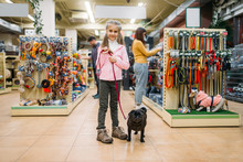 Little Girl With Puppy In Pet Shop, Friendship