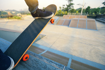 Wall Mural - skateboarder legs skateboarding on skatepark