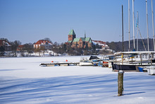 Cathedral Or Dom Of Ratzeburg At The Frozen Lake In Northern Germany At A Sunny Winter Day, View From The Sailing Port,copy Space