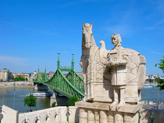 Hungary, Budapest. Statue of St. Stephen on Gellert Hill in Budapest and the Liberty bridge over Danube river.