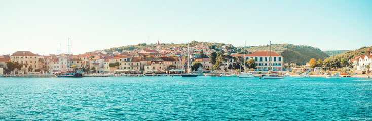 Wall Mural - POSTIRA, CROATIA - JULY 14, 2017: Beautiful harbor of a small town Postira with several yachts moored there - Croatia, island Brac