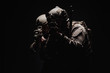 © kaninstudio - soldiers or private military contractors holding rifle. Image on a black background. war, army, weapon, technology and people concept