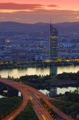 Wall Mural - sunset scene with Vienna city skyline and Danube river. Austria