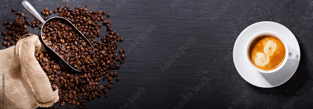 cup of coffee and coffee beans in a sack, top view - obrazy, fototapety, plakaty 