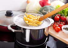 Cooking Pasta In A Pot With Boiling Water On A Cooker