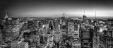 Fototapeta Fototapeta Nowy Jork - New York City. Manhattan downtown skyline with illuminated Empire State Building and skyscrapers at dusk. USA. Black and white image.