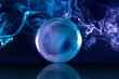 crystal ball in a dark blue smoky background