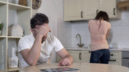 Fotografía Nervous wife crying quarreling with man, annoyed husband ignoring wife, breakup