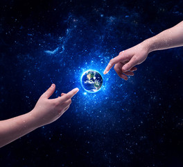 Hands in space touching planet earth