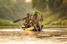 Asia Children Enjoying In Boat On Beautiful River