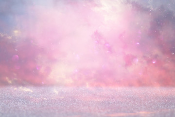 glitter vintage lights background. pink and purple. de-focused.