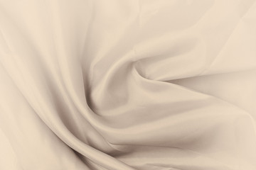 Smooth elegant silk or satin luxury cloth texture. Retro style, beige cream sepia color.