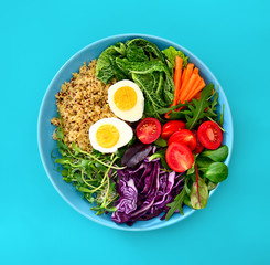 Fresh juicy and crusty buddha bowl healthy meal with quinoa and green sprouts