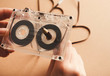 Vintage cassette and pencil to rewind tape on brown background